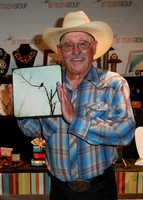 Barry Corbin with photograph of Cardinal by The Shutterbug Eye at GBK Primetime Emmys Gift Lounge