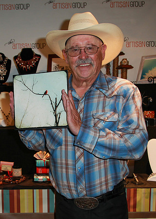 Barry Corbin with photograph of Cardinal by The Shutterbug Eye at GBK Primetime Emmys Gift Lounge