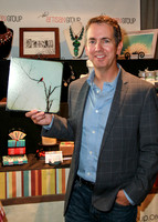 Gregg Binkley with photograph of Cardinal by The Shutterbug Eye at GBK Primetime Emmys Gift Lounge