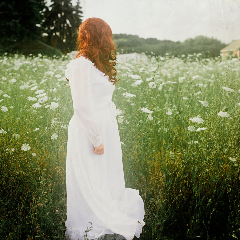 Woman in a field of Queen Anne's Lace