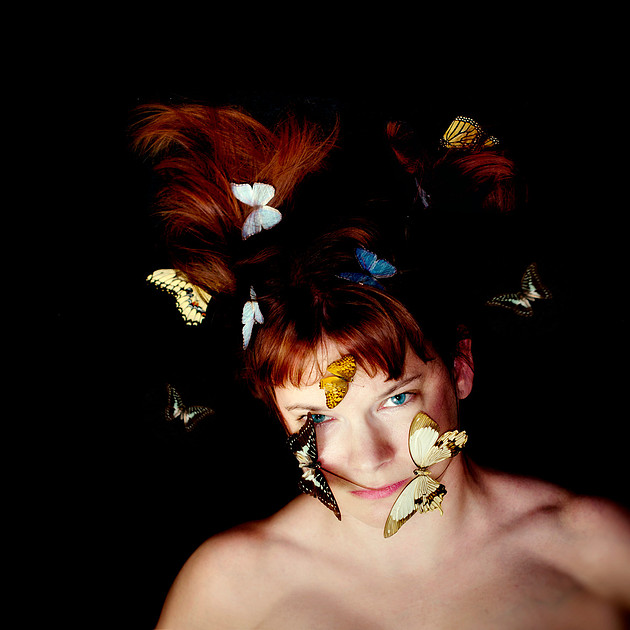 Surreal portrait photography woman with butterflies