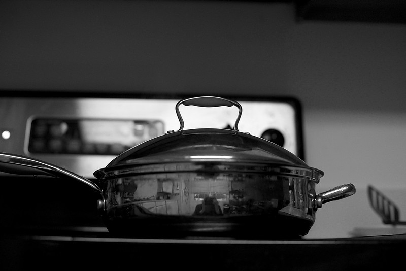 Cooking pan, stove top, black and white photo