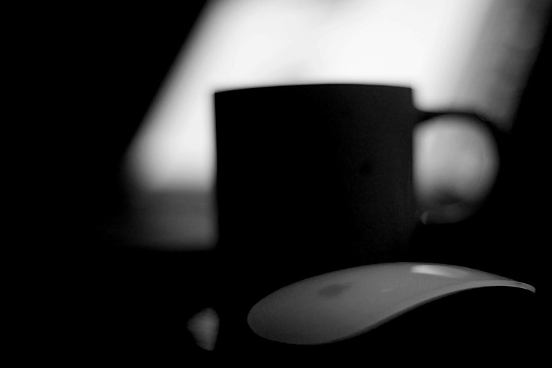 Dark black and white, computer mouse, coffee mug