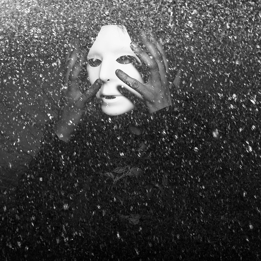 Black and white masked figure photography print