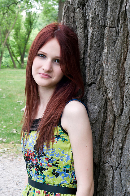 Portrait photograph against a tree.